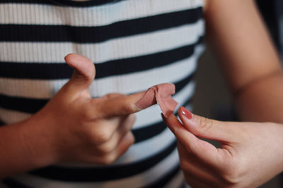 Midsection of woman holding hands