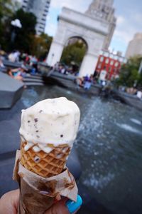 Close-up of hand holding ice cream