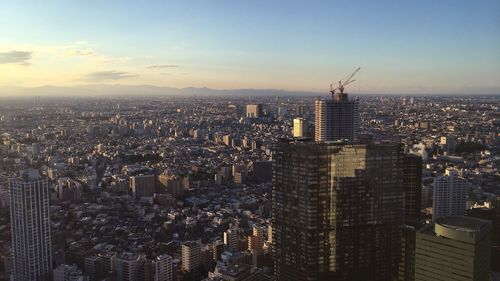 Aerial view of city against sky