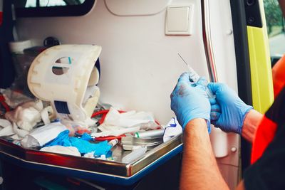 Paramedic holding syringe