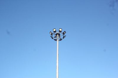 Low angle view of street light against clear blue sky