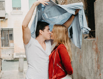 Young couple kissing in a traditional clothing