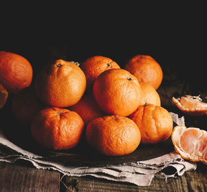 Close-up of oranges on table