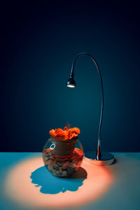 Close-up of tea cup on table against blue background