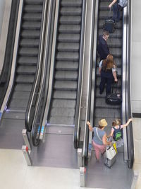 High angle view of people sitting on steps