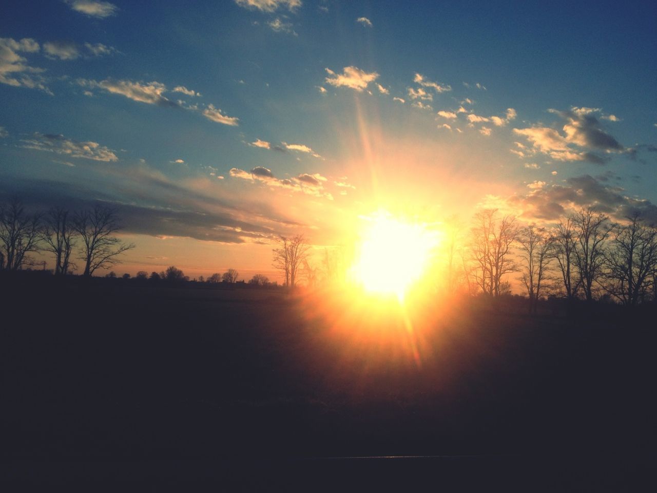 sunset, sun, silhouette, sky, tranquil scene, tranquility, scenics, beauty in nature, sunlight, tree, sunbeam, nature, cloud - sky, landscape, idyllic, orange color, cloud, outdoors, bare tree, no people