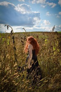 A girl standing in a field