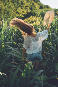 Full length of woman standing on field