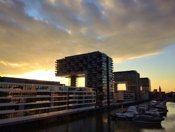 Buildings in city at sunset