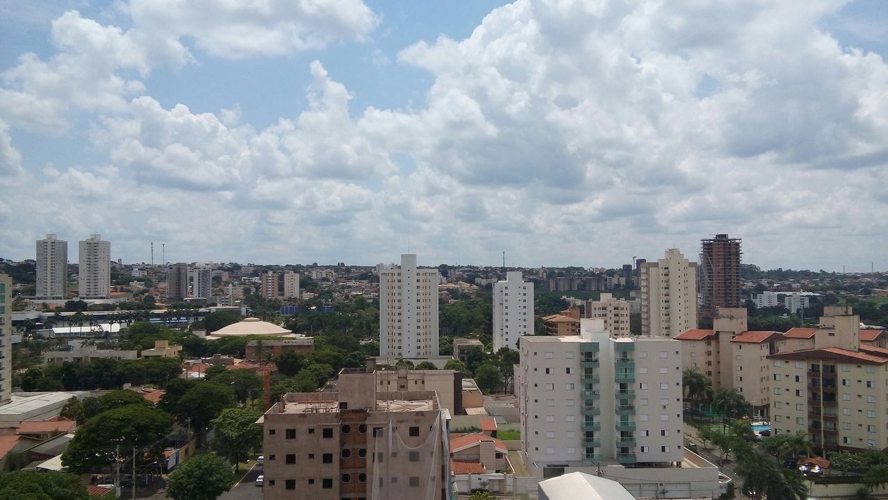 building exterior, architecture, built structure, city, sky, cityscape, cloud - sky, residential building, residential district, cloudy, residential structure, crowded, cloud, tree, high angle view, city life, building, day, outdoors, house