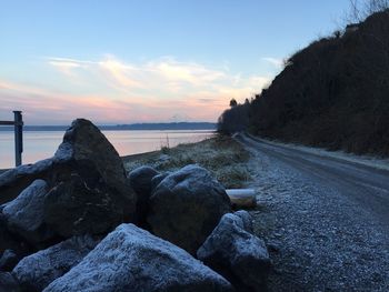 Scenic view of beach against sky during sunset