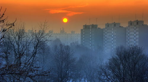 Scenic view of sunset over city