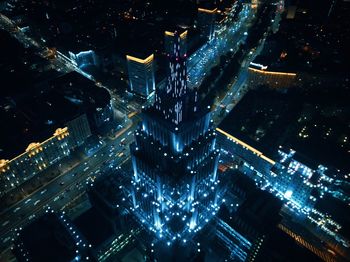 High angle view of illuminated buildings in city at night