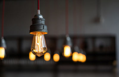 Close-up of illuminated light bulb