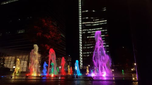 Low angle view of illuminated fountain at night