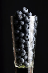 Close-up of frozen fruit against black background