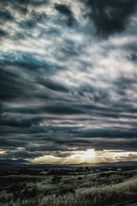 Scenic view of dramatic sky over land