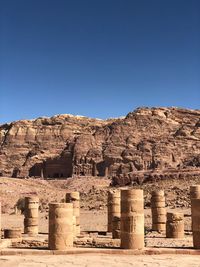 Built structure on mountain against blue sky