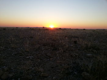 Scenic view of landscape at sunset