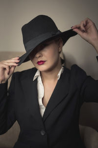 Portrait of beautiful woman wearing hat