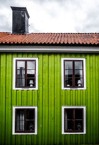 A picturesque swedish wooden green house. ideal for architectural showcases and vibrant designs.