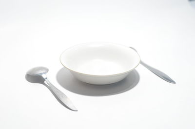 High angle view of coffee on table against white background