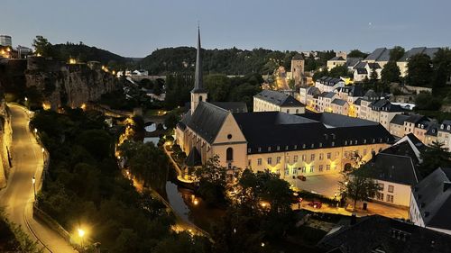 High angle view of illuminated buildings in city