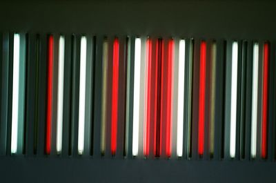 Low angle view of illuminated fluorescent lights