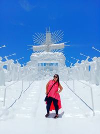 Woman standing on footpath at garinfarm pilgrimage resort