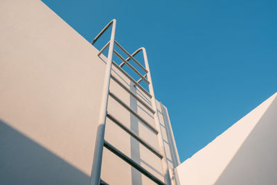 Low angle view of building against clear blue sky