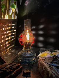 Close-up of illuminated lantern on table