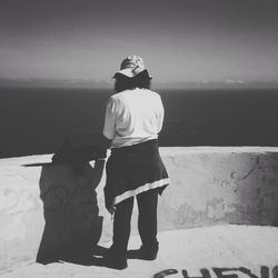 Rear view of man standing on beach