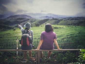 Rear view of woman looking at mountains