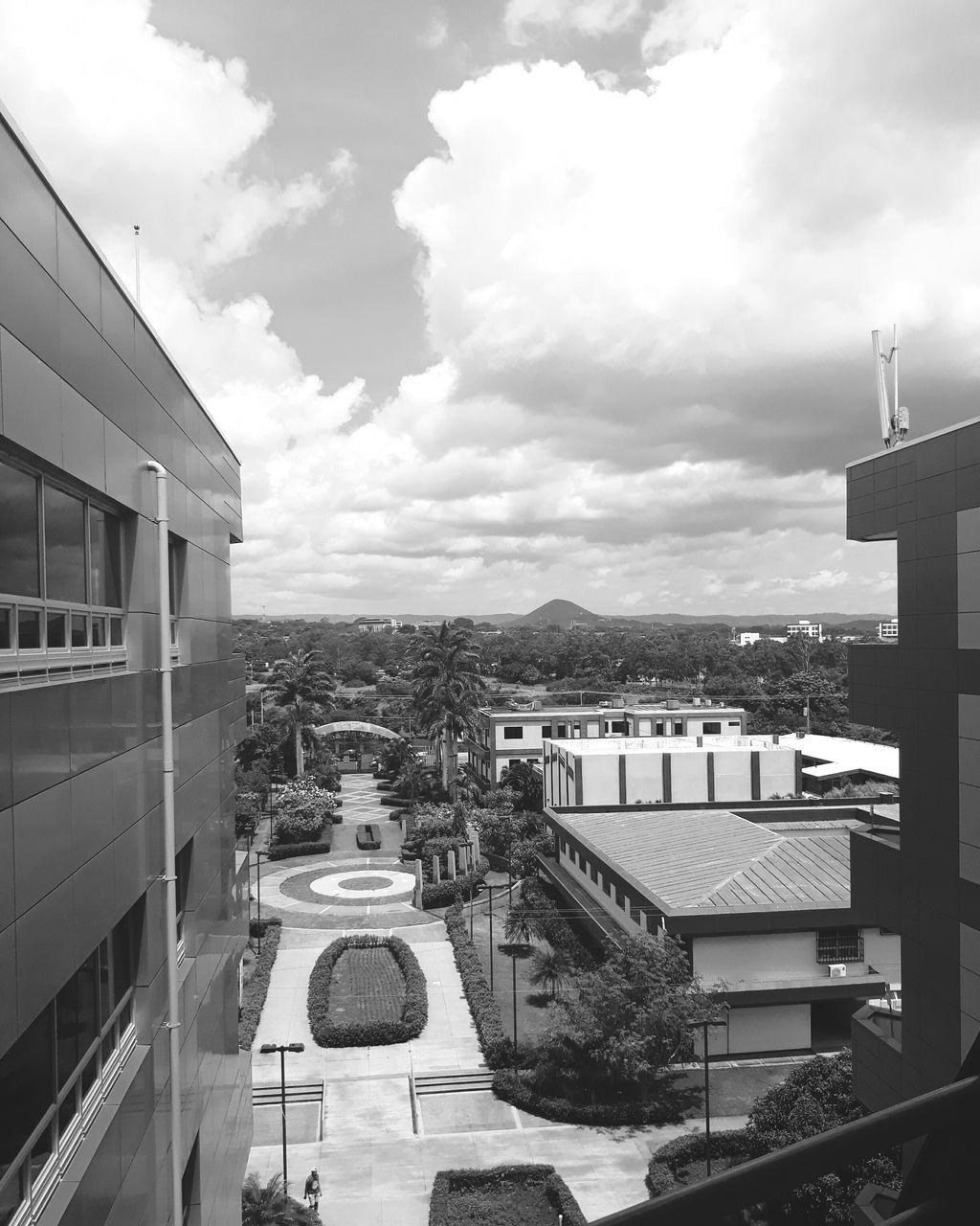 architecture, built structure, building exterior, cloud - sky, sky, high angle view, day, outdoors, no people, city, residential building, mountain, nature, tree, cityscape