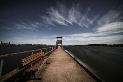 Pier over sea against sky