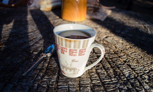 High angle view of coffee cup on table