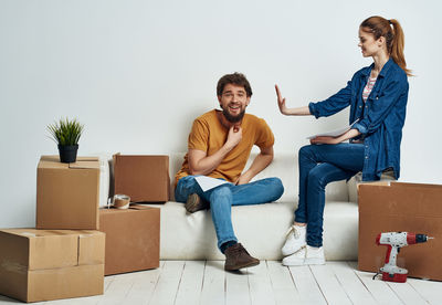 Young couple sitting in box