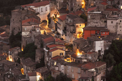 High angle view of buildings in city at night