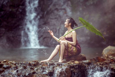 Woman looking at waterfall