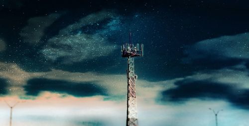 Low angle view of windmill against sky at night