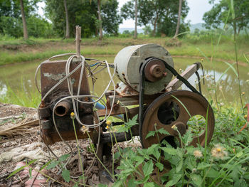 Old rusty wheel on field