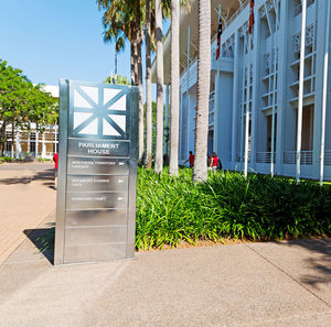 Text on footpath by building