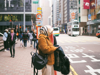 Rear view of woman on city street