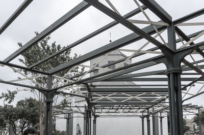 Low angle view of metal structure against sky