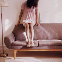 Teen girl sitting on sofa