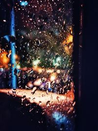 Close-up of wet glass window in rainy season