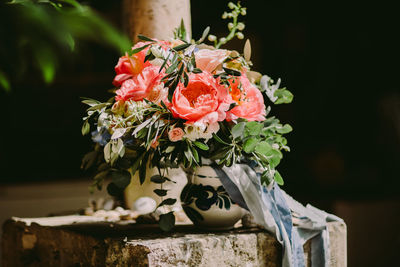 Close-up of rose in vase outdoors