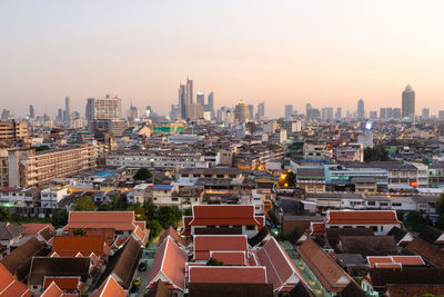 High angle view of buildings against sky during sunset