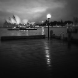Reflection of illuminated lights in puddle