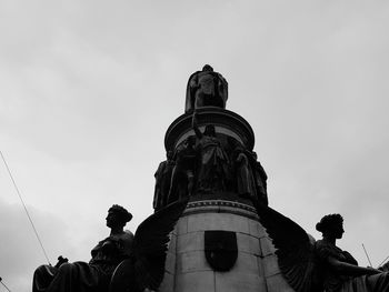 Low angle view of statue against sky